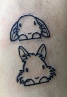 a tattoo with two images of animals on it