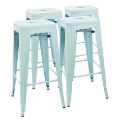 three white metal stools sitting next to each other in front of a white background