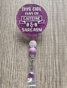 Fuel your workday with a touch of humor! The "This Girl Runs on Caffeine and Sarcasm" Badge Reel is perfect for the coffee lovers who tackle each day with a sharp wit. Featuring a playful design with bold typography, this badge holder adds personality to your daily essentials. Whether you're a nurse, teacher, or office worker, this badge reel will keep your ID secure while showcasing your love for caffeine and quick comebacks. It's a stylish, practical accessory that makes a statement and brings a smile to your face every time you clip it on. Ideal for anyone who embraces a little sass and a lot of coffee! Handcrafted with care, this badge reel features a combination of UV resin, glitter, E6000 glue, acrylic, plastic alligator clip reel, and playful plastic beads. Each element comes togeth Making Badge Reels, Quick Comebacks, Office Worker, Bold Typography