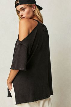 Take your tee game to the next level with this so cool version featured in an oversized, slouchy fit with exaggerated cutout at shoulder and defined distressing throughout for a true lived-in look.Fit: Slouchy, oversized fitFeatures: Scoop neckline, side slits at bottom, dropped shoulders, raw hems, subtle distressing throughoutWhy We <3 It: Designed to add effortless edge to any look, this super distressed tee is the perfect pick to pair with with anything from staple denim to a short to take y Oversized Washed Black T-shirt For Summer, Trendy Oversized Washed Tops, Oversized Washed Tops With Drop Shoulder, Relaxed Oversized Washed Tops, Oversized Washed Relaxed Tops, Oversized Washed Drop-shoulder Top, Oversized Washed Drop Shoulder Tops, Oversized Washed Top With Drop Shoulder, Edgy Washed Tops For Fall