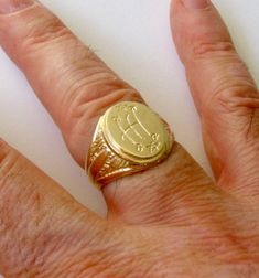 ❤️About the Item❤️ ✔ A round signet men's ring handcrafted by experienced craftsmen in real solid gold symbolizing life and positivity.  ❤️DISCOUNT AND OFFERS❤️ ✔ Please contact us for any discounts or offers that are available on this item. We also provide discounts on bank transfers. Please check the payments methods below! ❤️CUSTOMIZATION❤️ ✔ Please check our designs listed in our store and don't hesitate to contact us with any custom made jewelry piece. ✔ We can engrave custom text of your c Anniversary Signet Ring With Maker's Mark, Anniversary Round Signet Ring With Maker's Mark, Heirloom Round Signet Ring For Commemoration, Heirloom Signet Ring For Commemoration, Gold Signet Ring With Maker's Mark As Gift, Gold Engraved Ring With Maker's Mark As Gift, Gold Engraved Ring With Maker's Mark For Gift, Gold Signet Ring With Maker's Mark, Gold Round Signet Ring With Maker's Mark