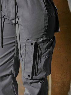 Details:Button \nStyle:Casual \nClosure Type:Elastic Waist \nDetails:Pocket \nDetails:Zipper \nColor:Dark Grey \nPattern Type:Plain \nType:Jogger \nWaist Line:Natural \nLength:Long \nFit Type:Loose \nFabric:Slight Stretch \nMaterial:Fabric \nComposition:100% Polyester \nCare Instructions:Hand wash,do not dry clean \nTemperature:Spring/Fall (18-25℃/63-77℉) \nBody:Unlined \nSheer:No \n Cargo Joggers, Type Of Pants, Casual Trousers, Zipper Detail, Fashion Online Shop, Jogger Pants, Trousers Women, Drawstring Waist, All Fashion