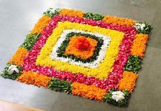 a colorful flower arrangement on the ground