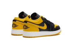 The Air Jordan 1 Low GS “Yellow Ochre” is the youth sizing of the retro basketball shoe in a black-and-yellow design.  The Jordan 1 Low “Yellow Ochre” features a yellow perforated leather toe, a yellow leather Swoosh, and a yellow leather heel tab.  Additional yellow accenting can be found on the collar and on the Jumpman branding on the tongue.  The toe, forefoot, eyelets, and mid-panel appear in black leather.  A black “Wings” logo is embroidered on the heel.  Release date: December 18, 2023 Yellow Retro Sneakers With Boost Midsole, Urban Yellow Sneakers With Gum Sole, Yellow Urban Sneakers With Gum Sole, Yellow Basketball Shoes With Boost Midsole For Streetwear, Yellow High-top Basketball Shoes For Streetwear, Yellow Low-top Basketball Shoes For Streetwear, Yellow Urban Custom Sneakers For Streetwear, Yellow Urban Low-top Basketball Shoes, Urban Style Yellow Custom Sneakers For Streetwear