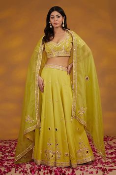 Yellow georgette lehenga with an attached cancan, tonal and contrasting floral pattern and mirror hand embroidery work. Comes with a matching embroidered padded blouse and a dupatta. - Aza Fashions Yellow Organza Sets With Mirror Work, Embroidered Pista Green Georgette Choli, Pista Green Georgette Choli With Resham Embroidery, Pista Green Georgette Lehenga With Mirror Work, Pista Green Organza Choli With Mirror Work, Pista Green Organza Lehenga With Mirror Work, Silk Lehenga With Mirror Work In Pista Green, Pista Green Silk Lehenga With Mirror Work, Pista Green Mirror Work Organza Lehenga