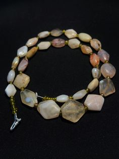 A beautiful string of Bended white agate natural found from Afghanistan dating 1800 yrs. They are found at that time in Afghanistan mostly but also some found in India and Pakistan too. They were used as a special charm jewellery by the affluents at that time period. Beautiful counter bronze are decorated further in between the beads. Carnelian Necklace, Name Necklaces, Crystal Bead Necklace, India And Pakistan, Carnelian Beads, White Agate, Jade Necklace, Time Period, Agate Stone