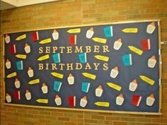 a bulletin board that says, september birthdays with lots of things on it in front of a brick wall