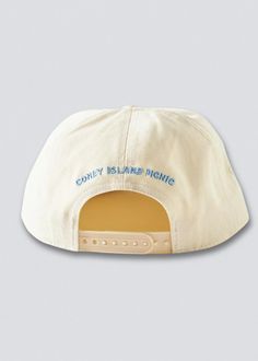 As seen on Hailey Bieber. Adjustable snapback baseball cap with Montauk embroidery at the front. Paneled fabrication finished with a flat brim. Circumference: Adjustable Unisex COLOR VARIATIONS: Ivory w/ Teal & Blue Embroidery Hot Pink w/ White Embroidery Red w/ Orange and White Embroidery Light Brown w/ Cream & Pink Embroidery Cream w/ Green & Gold Embroidery Black w/ White & Gold Embroidery Aqua Green w/ Hot Pink Embroidery Return Policy Shipping Policy