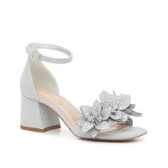 Kelly & Katie-Magg Sandal With a shimmer all its own, the Magg sandal from Kelly & Katie is a bold add to a night-out look. Shining floral details and a metallic sheen add some flair to round out your ensemble. Silver Glitter Sandals For Wedding, Glamorous Shimmer Sandals For Prom, Silver Block Heel Sandals For Prom, Sparkling Sandals For Spring Wedding, Spring Shimmer Block Heel Sandals, Embellished Silver Block Heel Sandals, Glamorous Silver Sparkling Sandals, Glamorous Silver Ankle Strap Sandals, Metallic Silver Round Toe Heels For Spring