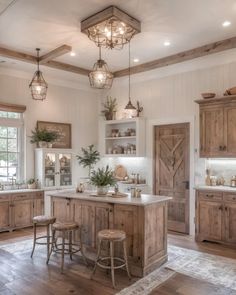 a large kitchen with wooden cabinets and white walls