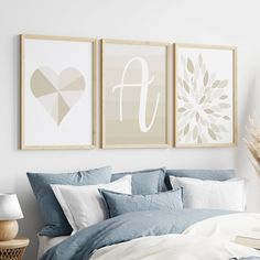 a bedroom with three framed pictures above the bed