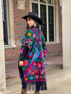 This Beautiful Hand Embroidered Poncho is perfect for keeping you warm and stylish at the same time. It has gorgeous hand embroidered details in both the front and back of the poncho. This poncho is handmade by Mexican Artisans and is completely one of a kind. Note: This poncho has open sides and comes in one size which is ideal for sizes, Small, Medium, Large, Extra Large, 2x, 3x. Rebosos Mexicanos Outfit, One Size Multicolor Kimono For Festivals, Traditional Multicolor Poncho With Floral Embroidery, Bohemian Multicolor Floral Embroidered Poncho, Traditional Multicolor Floral Embroidered Poncho, Traditional One-size Shawl Kimono, Traditional One Size Shawl Kimono, Traditional Multicolor Floral Embroidery Poncho, Multicolor Long Folk Kimono