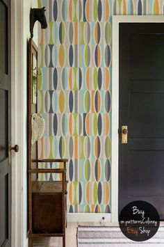 an entry way with a door and wallpaper