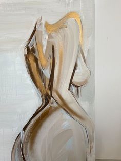 an abstract painting of a woman's torso in white and gold paint on canvas