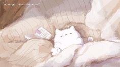 a white cat laying on top of a bed next to a pillow and book cover