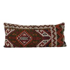 a decorative pillow with an intricate design on the front and back, sitting on a white background