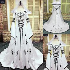 a white wedding dress with black flowers on it