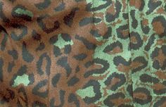 an animal print fabric with green and brown colors