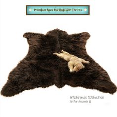 a brown bear rug with a baby laying on it's back in front of a white background