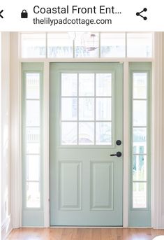 a blue front door with two windows and a light fixture on the ceiling above it