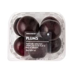 plums in a plastic container on a white background with the label labeled, woodworms