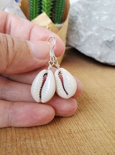 Pretty shell earrings to wear for many occasions. These simple Cowrie shell earrings, are natural shells and very light-wight to wear. I have a matching simple shell necklace in my shop if your looking for a matching necklace. They come on silver plated backings, but message me if you want Sterling Silver hooks (cost a bit more). Please view all of the photos for details. Choose at checkout to get the Earrings and Necklace. They will come in a small gift box ready to give as a gift. Do you want Cheap Adjustable Shell Earrings, White Teardrop Earrings For Beach, Silver Shell Earrings For Beach, Shell Earrings As Gift, Shell-shaped Earrings With Ear Wire, Nickel-free Shell Dangle Earrings, Shell-shaped Shell Earrings With Ear Wire, White Shell-shaped Earrings For Vacation, Nickel-free White Shell-shaped Earrings