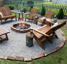 a fire pit surrounded by wooden chairs and tables