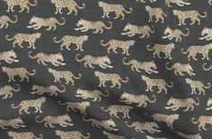 a black background with white and gold leopards on it's sides, all facing different directions