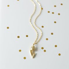 "Beautiful and lovely gold Tulip charm necklace. Made of a matte gold finish Tulip charm with a skinny gold plated brass chain. Soft and simple. Great for gift, everyday or special occasion. Your item will ship in a gift box. Please feel free to contact me if you have any questions. ♥ Length 14\" - 20\" chain ♥ Tulip charm 3/8\" x 5/8\" long ♥ Gold plated over brass ♥ See more Rudiana Accessories Rudiana.etsy.com" Carving Jewelry, Tulip Necklace, Necklace Flower, Gift Graduation, Jewelry Stand, Layered Necklace, Girls Jewelry, Brass Chain, Flower Necklace