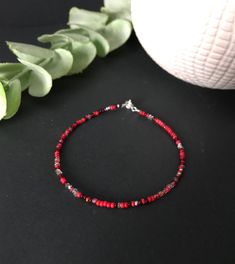 "Lovely combination of reds in a dainty and cute bracelet which can also be an anklet. This comes in 10 sizes at checkout! ❤SIZES This item comes in several sizes, kindly choose at checkout. The standard size for an average woman is 7\". For a child, perhaps a 6\" would be appropriate. If you'd like a clasp extender because you are unsure of the right size, please add this to the cart: https://www.etsy.com/listing/187503833/clasp-extender ❤ PROCESSING AND SHIPPING Most orders are made and shipped out in one business day. Please check delivery timeframes for your location on the description below.  ❤ CUSTOM ORDERS If you like this item in a different color, send me a message indicating: color, size and quantity needed. I will send you a link for a \"custom order\" and you'll be able to plac Red Beaded Bracelet Color Combos, Red Seed Bead Bracelet, Red Beads Bracelet, Average Woman, Red Beaded Bracelet, Red Bracelet, Bracelet Craft Diy, Blue Beaded Necklace, Bracelets Design