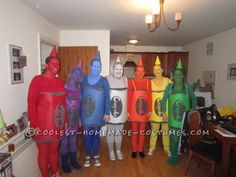 group of people dressed up in costumes standing next to each other