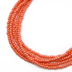 "A pretty opaque orange seed bead necklace. The color is orange coral color that has a slight luster. It is very pretty! The necklace could be layered with others or worn alone. Bright and cheerful! The necklace will be made to order and is available in many different lengths, from short to extra-long. I hand string these seed beads on beading wire and finish them with a sterling silver lobster clasp and ring. This is a single strand necklace, but the longer lengths can be wrapped. NOTES ABOUT C Orange Beaded Necklace, Orange Jewelry, Orange Necklace, Sterling Silver Bead Bracelet, Silver Bead Necklace, Orange Coral, Silver Bead Bracelet, Beading Wire, Seed Bead Necklace