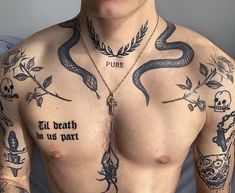 a shirtless man with tattoos on his chest