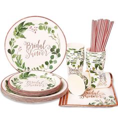 the bridal and shower tableware is set with plates, cups, napkins, straws and paper straws