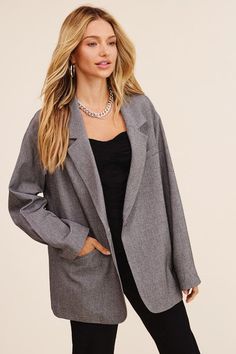 This blazer redefines elegance with its oversized silhouette that effortlessly bridges comfort and style. The welt pocket on the right front adds a touch of functionality and charm. The long sleeves offer versatility for various occasions, making it suitable for both formal and casual settings. With a clean and minimalistic design, the one-button closure provides a polished finish that complements the overall aesthetic. - Model is 5' 9" 33-24-34 and wearing a size Small Style: Casual Print / Pat Gray Long Sleeve Blazer With Pockets, Trendy Oversized Blazer With Lapel Collar, Oversized Trendy Blazer With Lapel Collar, Fall Office Wear Blazer With Notch Lapel, Fall Business Blazer With Notched Lapel, Gray Lapel Collar Blazer For Spring, Spring Gray Blazer With Lapel Collar, Chic Oversized Outerwear With Welt Pockets, Trendy Notched Blazer For Formal Occasions