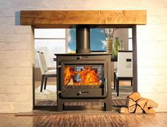 a wood burning stove sitting inside of a living room