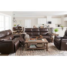 a living room filled with furniture and a coffee table