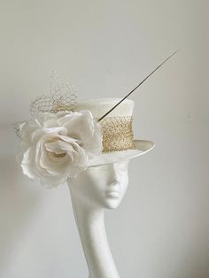 Ivory white gold hat This amazing ivory white gold hat is made from ivory colour sinamay fabric. On the side is sitting silk flower and gold netting and a gold feather. the hat will be an amazing accessory to compliment your outfit. It will fit the average head size 54-55cm You can wear this amazing hat at the wedding, Christening, Royal Ascot races, and any other special occasion. Enjoy and please have a look at my hats and fascinators in my shop  https://www.etsy.com/uk/shop/KristineRosahats?r White Adjustable Top Hat With Short Brim, Adjustable White Top Hat With Short Brim, White Fitted Top Hat With High Crown, Elegant Fitted Costume Hat With Tall Crown, Cream Short Brim Top Hat For Formal Occasions, Gold Top Hat With Short Brim For Kentucky Derby, Gold Costume Hats For Kentucky Derby With Short Brim, Gold Costume Hat With Short Brim For Kentucky Derby, White Structured Crown Hat For Kentucky Derby