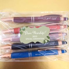 four pens are in a plastic bag with the words pure worship written on one side