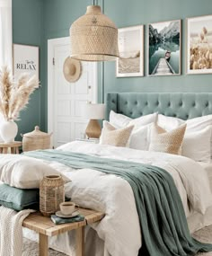 a bedroom with blue walls and white bedding, wicker baskets hanging from the ceiling