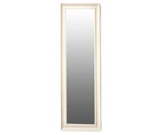 a white mirror sitting on top of a wall