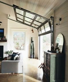 a living room filled with furniture and a fire place