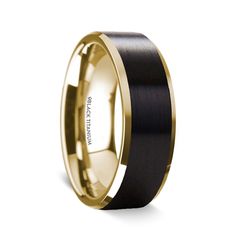 a black and gold wedding band with an interior inlayed to the center, on a white background