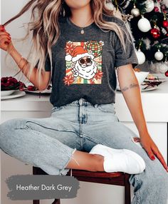 OxbridgeCo Retro Santa Shirt, Santa Claus Shirt, Vintage Santa Shirt, Christmas Shirt, Christmas Party Tee, Christmas Santa Shirt,Funny Christmas Shirt This customized gift can be used by all the members of family, it will be the best wanderlust, travel apparel unisex personalized shirt ever! 👉 Product Details:The T-Shirts, Hoodies, Youth, Toddler and Baby Suits(onesie) are unisex.👈 👉Reading the Sizing Chart: Please note that the sizing chart includes the measurements of one side of the shirt, not the circumference. 👈 👉Please review all the sizing charts that were added in the product pictures. 👉How Do I Order👈 1️⃣ Please review all the information provided before placing an order 2️⃣ Select the shirt type and size using the drop down menu. 3️⃣ Select the color of the shirt using th Fun Christmas T-shirt For Holiday, Funny Christmas Holiday Tops, Fun Christmas Graphic Print Tops, Fun Crew Neck Tops For Holiday, Casual Festive Tops For Christmas, Fun Holiday Graphic Print Tops, Fun Christmas Crew Neck T-shirt, Fun Christmas T-shirt With Graphic Print, Casual Christmas Tops With Funny Print