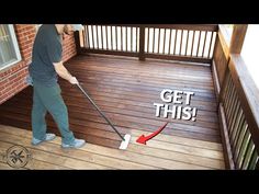 a man is cleaning the deck with a mop and an advertise that reads, get this