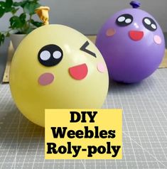 two yellow and purple balls with faces on them