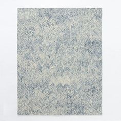 an abstract blue and white painting with leaves on the bottom, against a white background