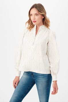 Add a touch of luxury to your wardrobe with this long sleeve shirt, made from luxe cotton silk slub with a modern and timeless vertical stripe design. Featuring a chic Mandarin collar, a front button and loop half placket, long puff sleeves, and gathered detailing at the shoulders and back yoke, this shirt's A-line fit offers a flattering silhouette, effortlessly blending timeless style with contemporary flair. By Trina Turk. Pair it with your favorite Carrie Dunham bag! Saharan Cotton Silk Slub 44% Silk, 40% Cotton, 13% Polyamide, 3% Polyester Dry clean only Fabric from Italy Mandarin collar Front button and loop half placket Long puff sleeves Gathered at shoulders and back yoke A-line fit Runs true to size Model is 5'10", wearing size S Wrap Shoes, Embroidered Monogram, Long Puff Sleeves, Trina Turk, Mandarin Collar, Cotton Silk, Stripes Design, Timeless Style, Dress Accessories