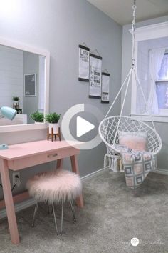 a pink desk and chair in a room with gray carpeted flooring, white walls and windows