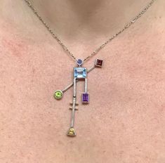 14k gold Sterling silver & platinum Modernist design handmade by Jerry Daskin Blue topaz Garnet Tanzanite Citrine Peridot Amethyst Modernist Design, Sterling Silber, Blue Topaz, Pendant Necklaces, Citrine, Garnet, Topaz, Arrow Necklace, Jewelry Necklace Pendant